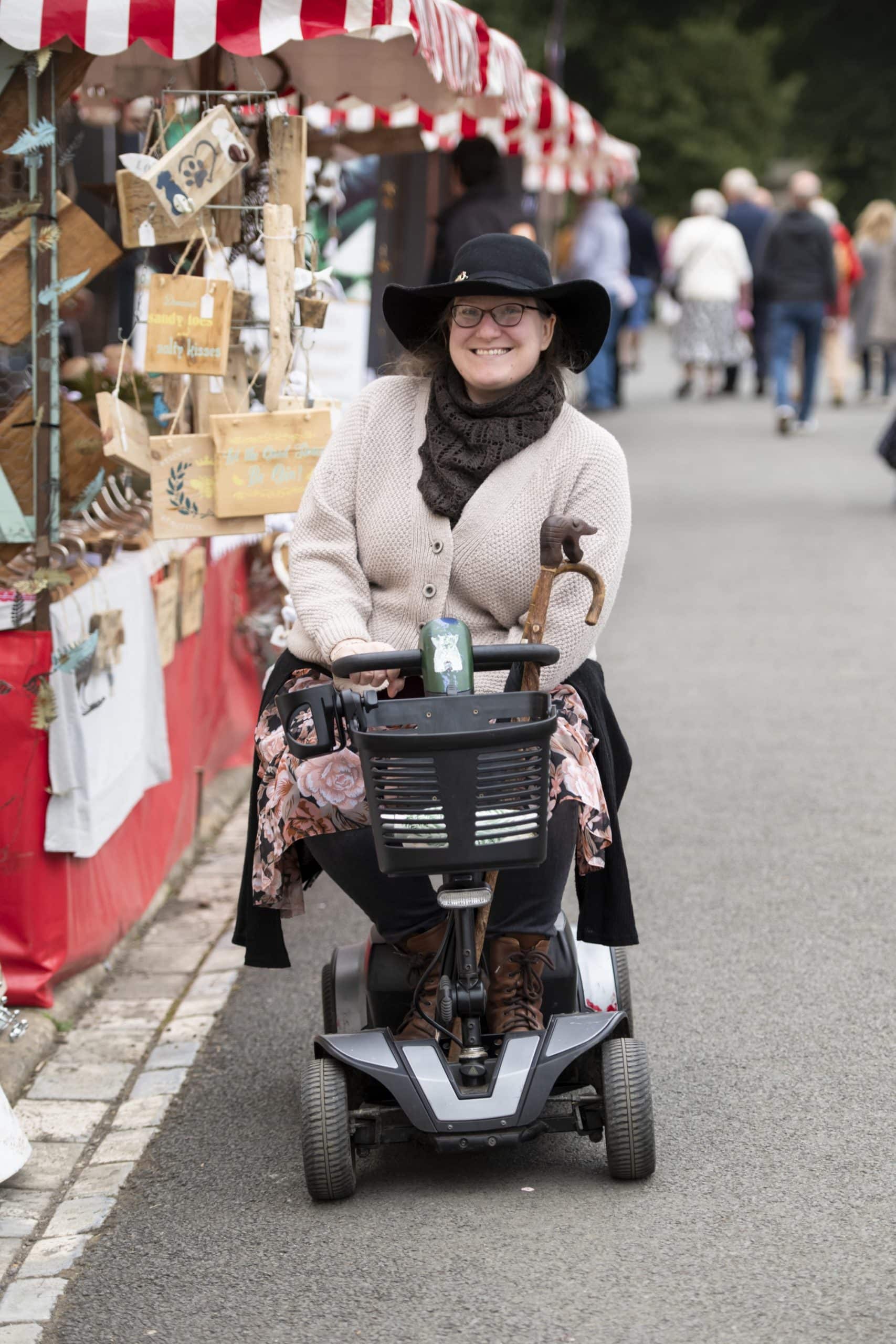Visitor on a motorised scooter at Raby Castle's summer market