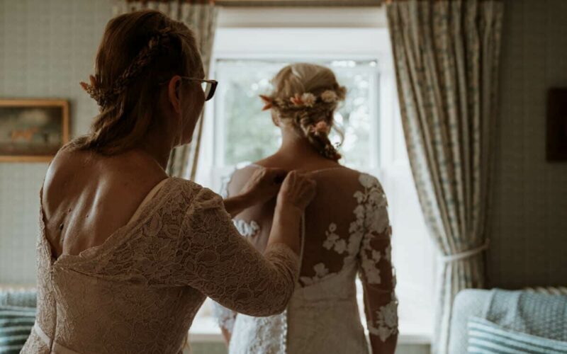 The final touches to the Brides dress for the perfect waterfall wedding at High Force