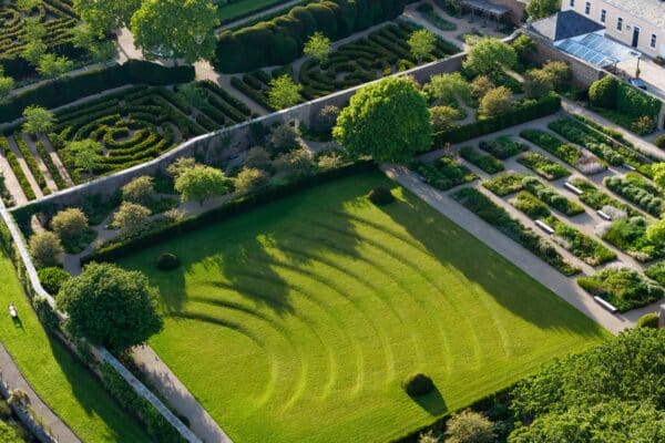 Raby Castle’s Historic Walled Garden Beautifully landscaped Walled Garden at Raby Castle featuring vibrant flower beds, trimmed hedges, and stone pathways.