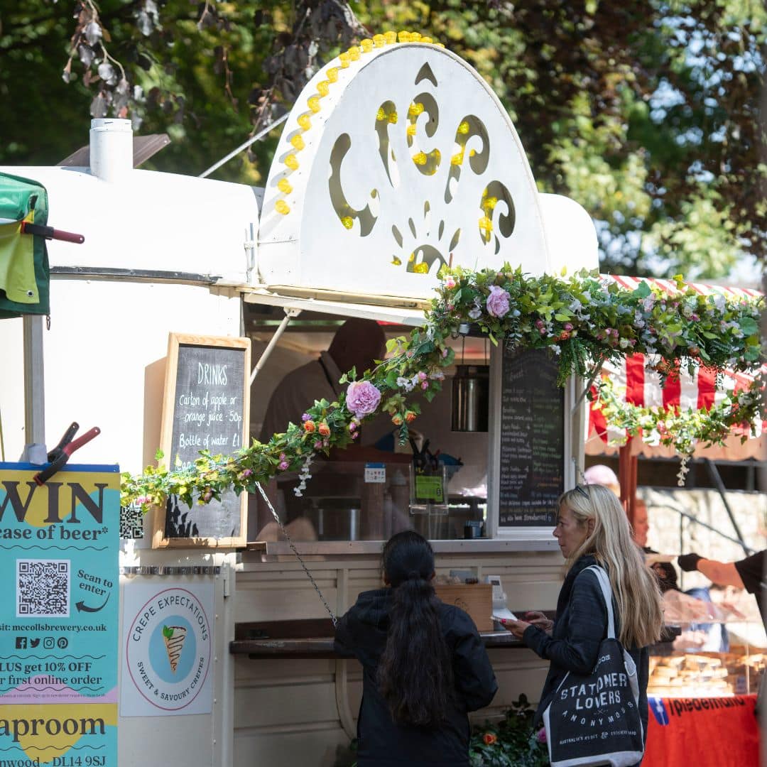 Vibrant food stalls offering street food favourites in the grounds of Raby Castle.